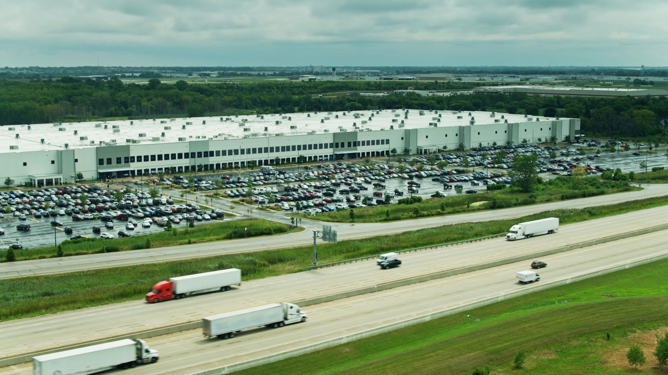 Aerial view of a large logistics distribution site with yard space and transport access