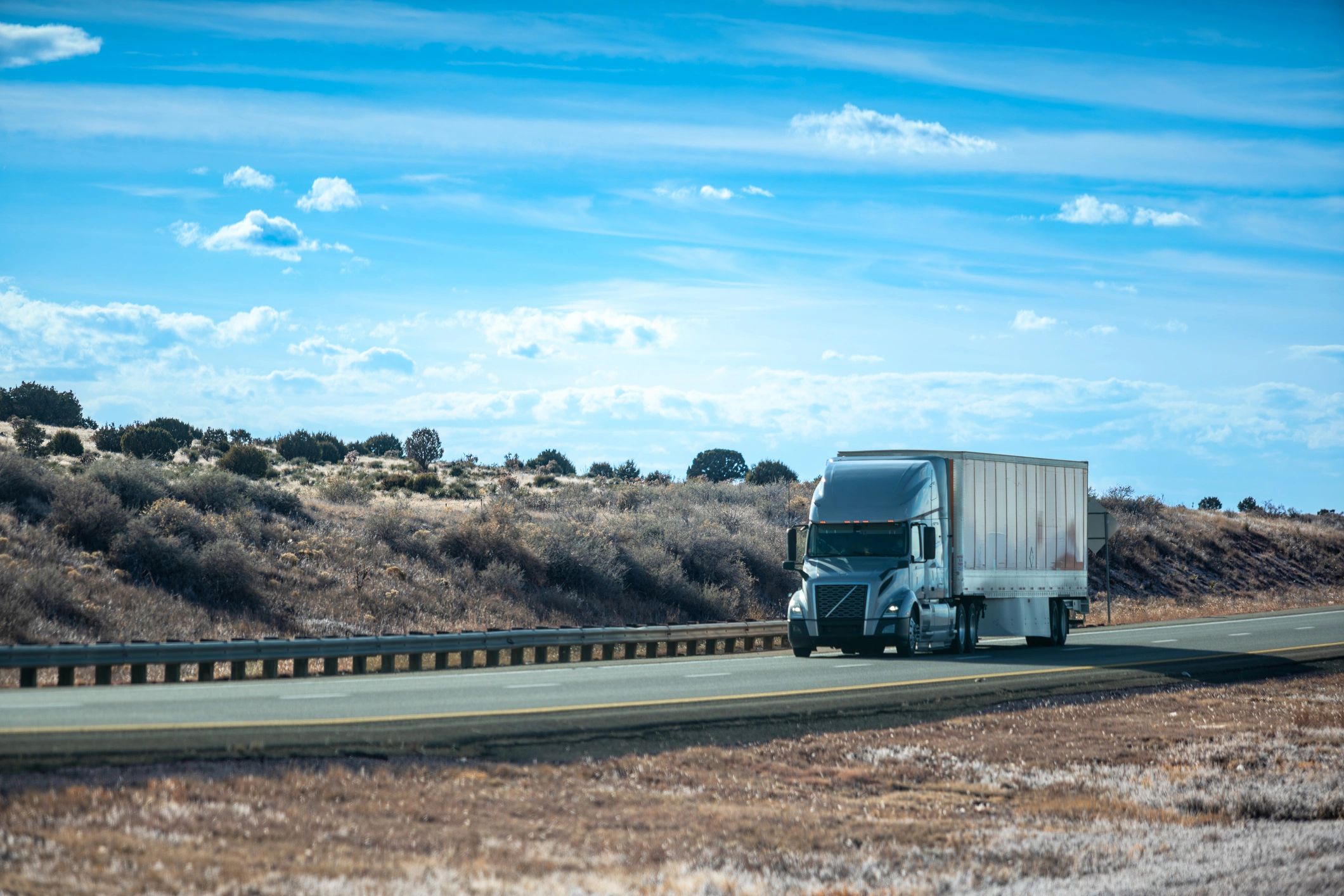 Modern semi-truck hauling freight on open highway